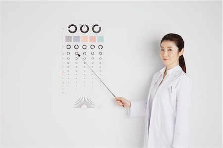 pointing - Attractive Japanese woman doctor Stock Photo - Premium Royalty-Free, Code: 622-08482634
