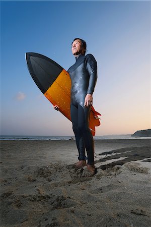 Japanese surfer portrait on the beach Stock Photo - Premium Royalty-Free, Code: 622-08512638