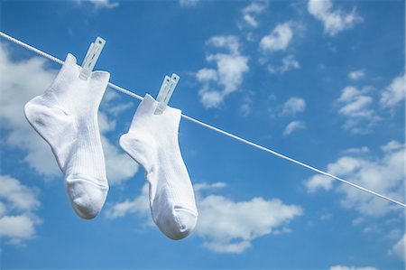 simsearch:622-08122813,k - Laundry hanging against blue sky Photographie de stock - Premium Libres de Droits, Code: 622-08542958