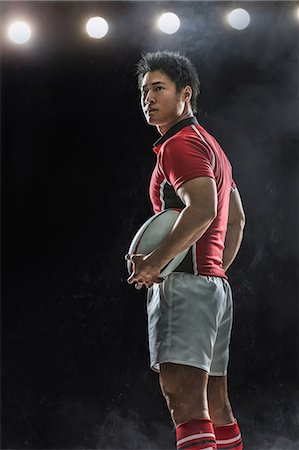 simsearch:622-08657615,k - Portrait of Japanese rugby player with ball Stock Photo - Premium Royalty-Free, Code: 622-08657620