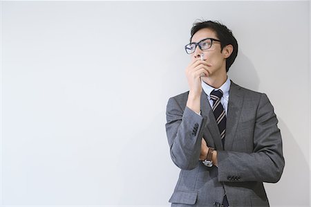 etiquette men - Japanese businessman in smoking room Stock Photo - Premium Royalty-Free, Code: 622-08657635