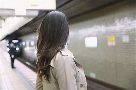 Young attractive Japanese woman waiting for the train Stock Photo - Premium Royalty-Free, Code: 622-08657770