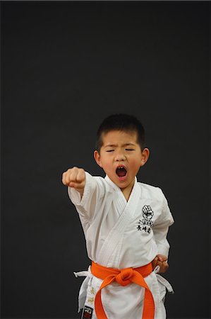 simsearch:622-08657807,k - Japanese kid in karate uniform on black background Stock Photo - Premium Royalty-Free, Code: 622-08657857