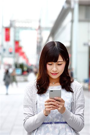 simsearch:859-06538080,k - Fashionable Japanese woman with smartphone in luxury Tokyo area, Tokyo, Japan Stock Photo - Premium Royalty-Free, Code: 622-08893791