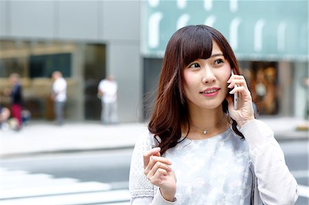 small town shopping - Fashionable Japanese woman on the phone in luxury Tokyo area, Tokyo, Japan Stock Photo - Premium Royalty-Free, Code: 622-08893803