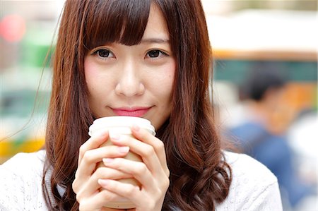 drinker walking - Fashionable Japanese woman with coffee in luxury Tokyo area, Tokyo, Japan Stock Photo - Premium Royalty-Free, Code: 622-08893813