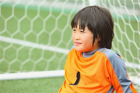 Japanese kid playing soccer Stock Photo - Premium Royalty-Free, Code: 622-08893857