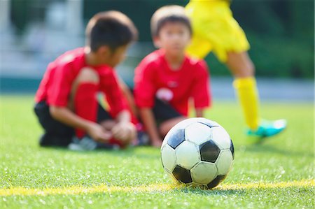 Japanese kids playing soccer Stock Photo - Premium Royalty-Free, Code: 622-08893870