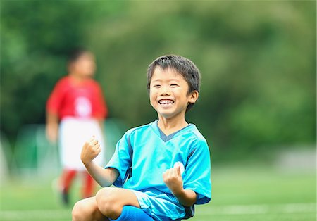 soccer field kid - Japanese kid playing soccer Stock Photo - Premium Royalty-Free, Code: 622-08893896