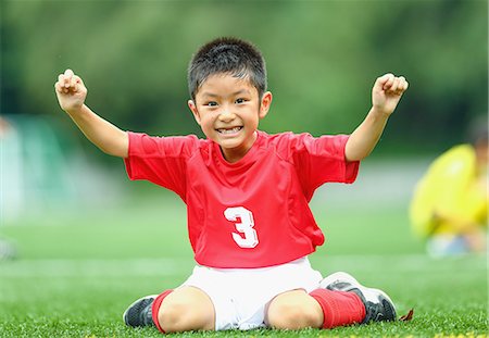 soccer children celebrate - Japanese kid playing soccer Stock Photo - Premium Royalty-Free, Code: 622-08893897