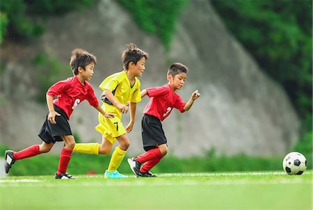 Japanese kids playing soccer Stock Photo - Premium Royalty-Free, Code: 622-08893937