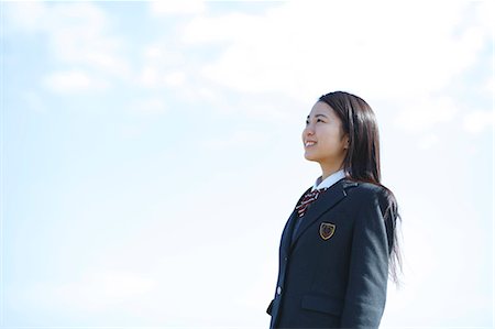 Young Japanese woman in a high school uniform by the sea, Chiba, Japan Stock Photo - Premium Royalty-Free, Code: 622-08949158