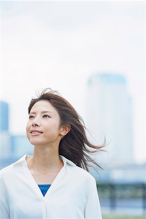 female front - Portrait of young Japanese woman downtown Tokyo, Japan Stock Photo - Premium Royalty-Free, Code: 622-09014009