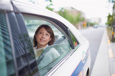simsearch:622-09014015,k - Young Japanese woman riding a taxi downtown Tokyo, Japan Stock Photo - Premium Royalty-Free, Code: 622-09014024