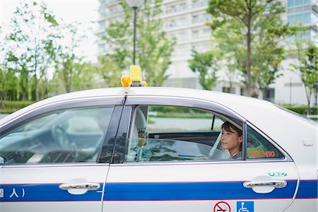 simsearch:622-09014015,k - Young Japanese woman riding a taxi downtown Tokyo, Japan Stock Photo - Premium Royalty-Free, Code: 622-09014022