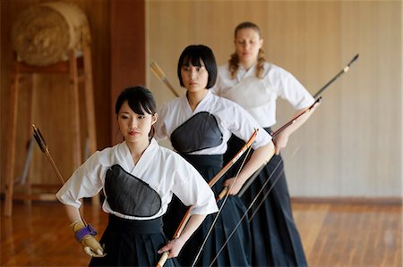 simsearch:859-09018730,k - Multi-ethnic group of traditional archery athletes practicing Stock Photo - Premium Royalty-Free, Code: 622-09014486