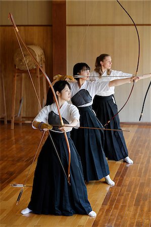 simsearch:859-09018730,k - Multi-ethnic group of traditional archery athletes practicing Stock Photo - Premium Royalty-Free, Code: 622-09014488
