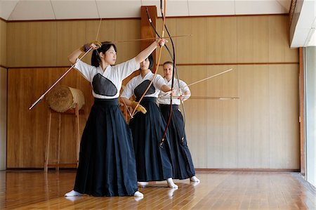 simsearch:859-09018730,k - Multi-ethnic group of traditional archery athletes practicing Stock Photo - Premium Royalty-Free, Code: 622-09014482