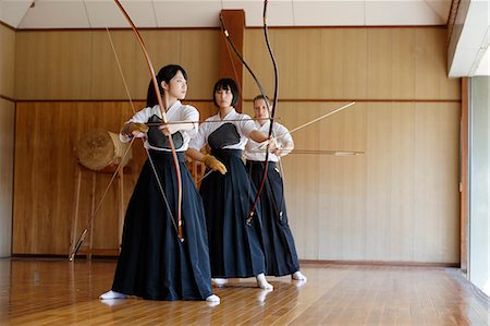 simsearch:859-09018730,k - Multi-ethnic group of traditional archery athletes practicing Stock Photo - Premium Royalty-Free, Code: 622-09014483