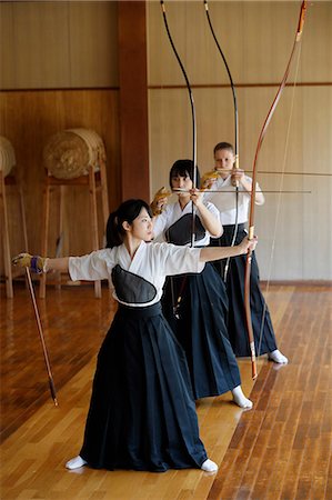 simsearch:859-09018730,k - Multi-ethnic group of traditional archery athletes practicing Stock Photo - Premium Royalty-Free, Code: 622-09014494