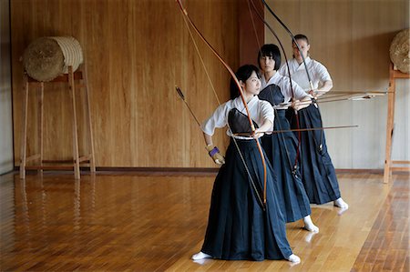 simsearch:859-09018730,k - Multi-ethnic group of traditional archery athletes practicing Stock Photo - Premium Royalty-Free, Code: 622-09014495