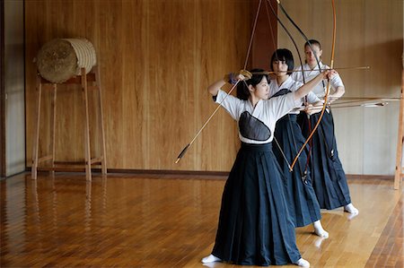 simsearch:859-09018730,k - Multi-ethnic group of traditional archery athletes practicing Stock Photo - Premium Royalty-Free, Code: 622-09014498