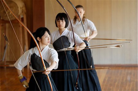 simsearch:859-09018730,k - Multi-ethnic group of traditional archery athletes practicing Stock Photo - Premium Royalty-Free, Code: 622-09014490