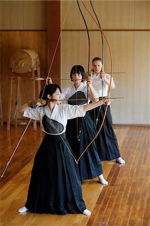 simsearch:859-09018730,k - Multi-ethnic group of traditional archery athletes practicing Stock Photo - Premium Royalty-Free, Code: 622-09014491