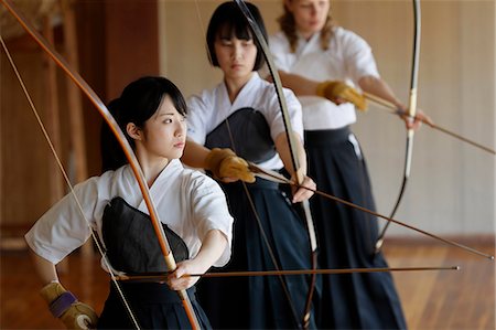simsearch:859-09018730,k - Multi-ethnic group of traditional archery athletes practicing Stock Photo - Premium Royalty-Free, Code: 622-09014492