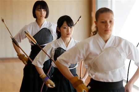 simsearch:859-09018730,k - Multi-ethnic group of traditional archery athletes practicing Stock Photo - Premium Royalty-Free, Code: 622-09014493