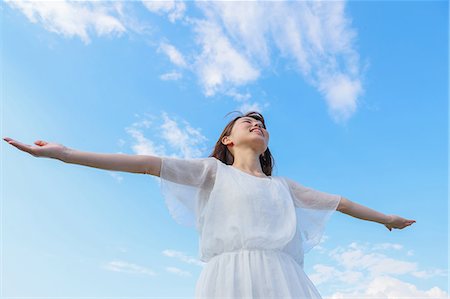simsearch:622-09014015,k - Young Japanese woman against blue sky Stock Photo - Premium Royalty-Free, Code: 622-09014567