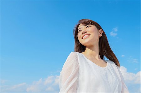simsearch:622-09014015,k - Young Japanese woman against blue sky Stock Photo - Premium Royalty-Free, Code: 622-09014572