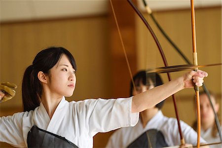 simsearch:859-09018730,k - Multi-ethnic group of Japanese traditional archery athletes practicing Stock Photo - Premium Royalty-Free, Code: 622-09014595
