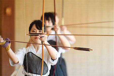 simsearch:859-09018730,k - Multi-ethnic group of traditional archery athletes practicing Stock Photo - Premium Royalty-Free, Code: 622-09014596