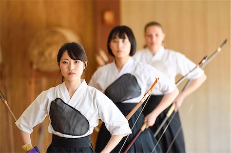 simsearch:859-09018730,k - Multi-ethnic group of traditional archery athletes practicing Stock Photo - Premium Royalty-Free, Code: 622-09014592