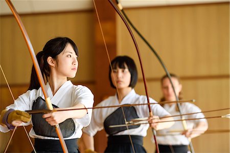 simsearch:859-09018730,k - Multi-ethnic group of traditional archery athletes practicing Stock Photo - Premium Royalty-Free, Code: 622-09014593