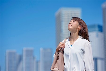 simsearch:622-09014015,k - Portrait of young Japanese woman downtown Tokyo, Japan Stock Photo - Premium Royalty-Free, Code: 622-09013957
