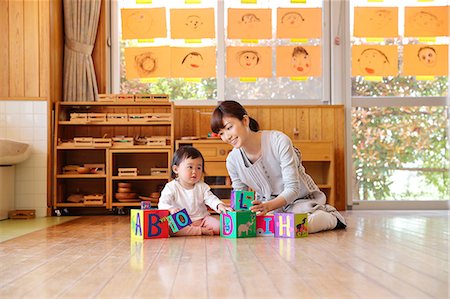 Teacher with kid at Japanese kindergarten Stock Photo - Premium Royalty-Free, Code: 622-09056228