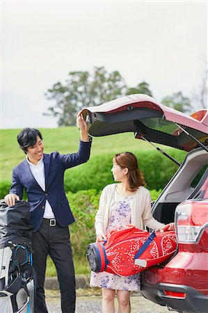 simsearch:693-06022169,k - Japanese couple preparing to play golf Stock Photo - Premium Royalty-Free, Code: 622-09148382