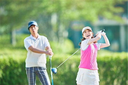 Japanese golf players on course Stock Photo - Premium Royalty-Free, Code: 622-09148397