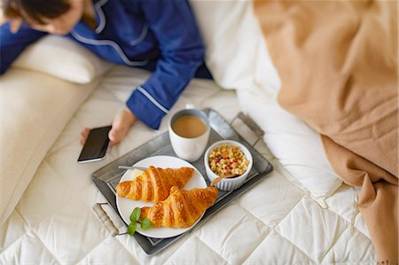 simsearch:622-08542976,k - Japanese woman having breakfast in bed Stock Photo - Premium Royalty-Free, Code: 622-09169587