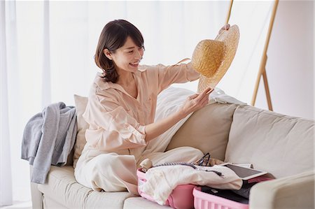 stopfen - Young Japanese woman on sofa Stockbilder - Premium RF Lizenzfrei, Bildnummer: 622-09169650
