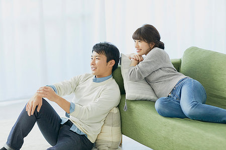 Japanese couple on the sofa Stock Photo - Premium Royalty-Free, Code: 622-09175793