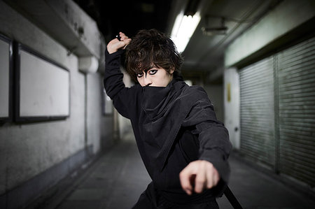 Japanese ninja at night downtown Tokyo Stock Photo - Premium Royalty-Free, Code: 622-09175918