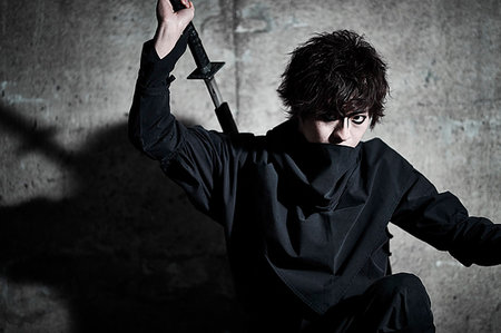 Japanese ninja at night downtown Tokyo Stock Photo - Premium Royalty-Free, Code: 622-09175921