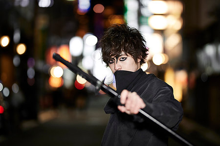 Japanese ninja at night downtown Tokyo Stock Photo - Premium Royalty-Free, Code: 622-09175935