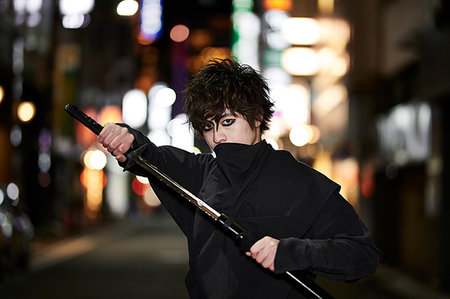 Japanese ninja at night downtown Tokyo Stock Photo - Premium Royalty-Free, Code: 622-09175936