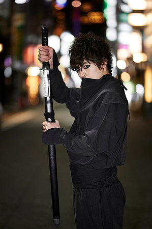 Japanese ninja at night downtown Tokyo Stock Photo - Premium Royalty-Free, Code: 622-09175937