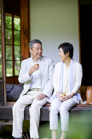 Japanese senior couple having fun at traditional inn Stock Photo - Premium Royalty-Free, Code: 622-09176145