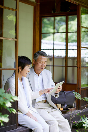 Japanese senior couple having fun at traditional inn Stock Photo - Premium Royalty-Free, Code: 622-09176157